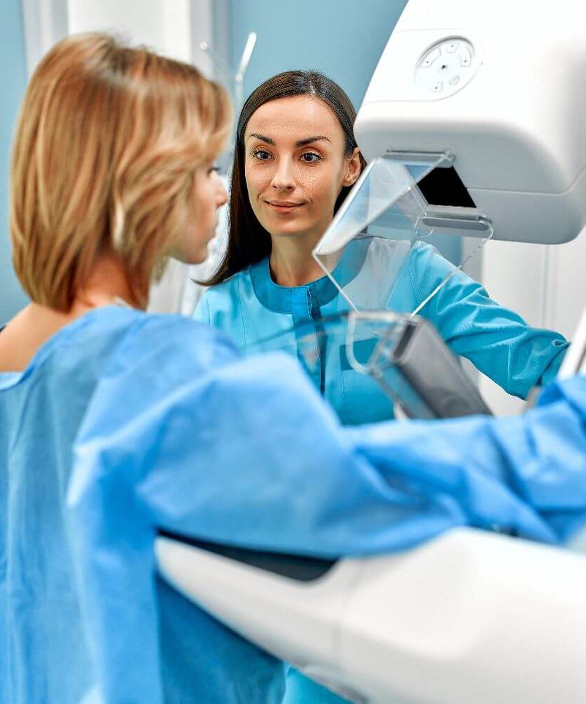 Patient receiving a 3D mammogram.
