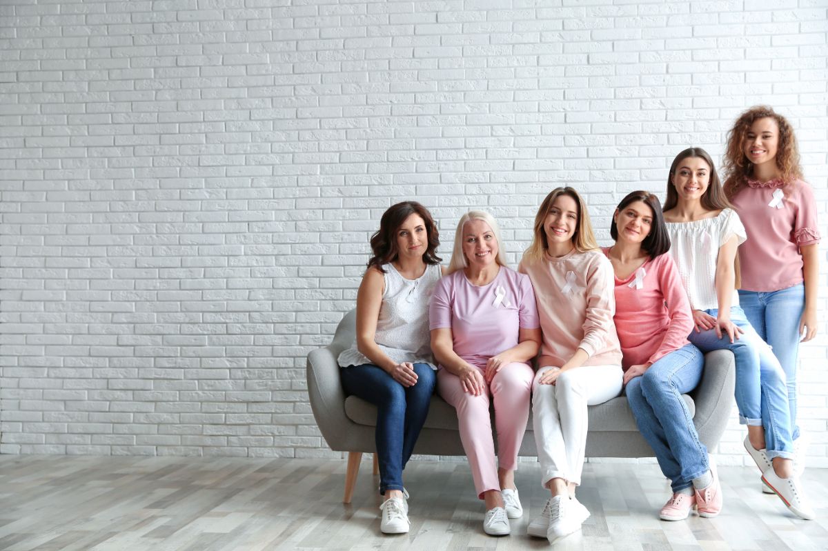 A group of woman sitting on a couch